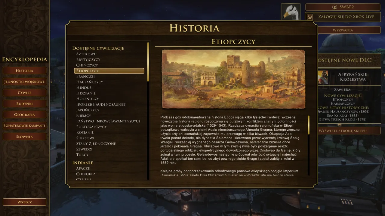 Age of Empires Definitive Edition spolszczenie: encyklopedia historii Etiopczyków z widokiem na miasto i opisem.