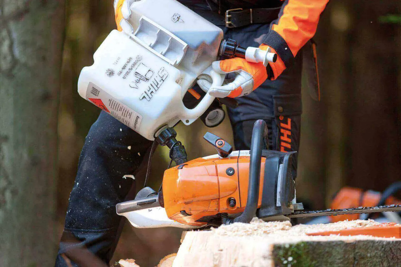chainsaw user mixing fuel