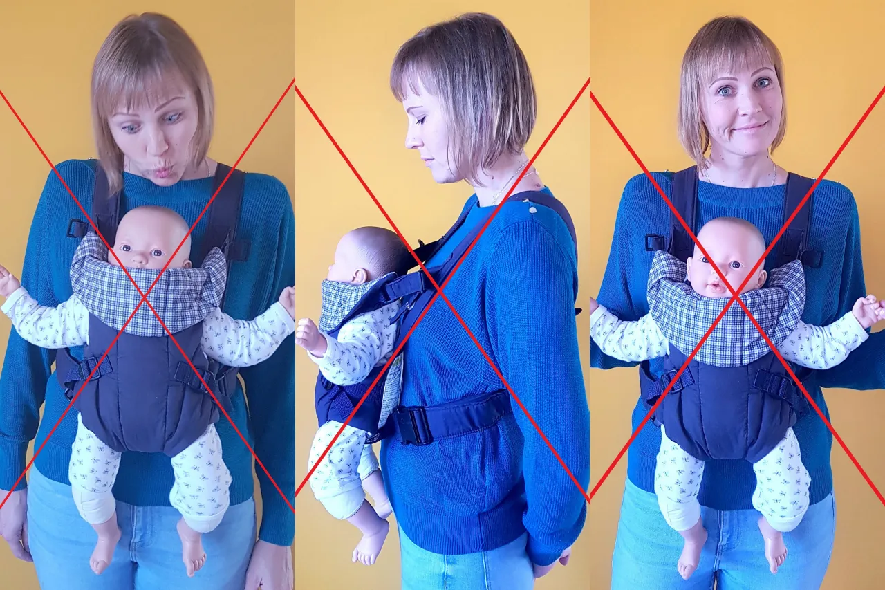 Rodzic noszący dziecko przodem w nosidle ergonomicznym