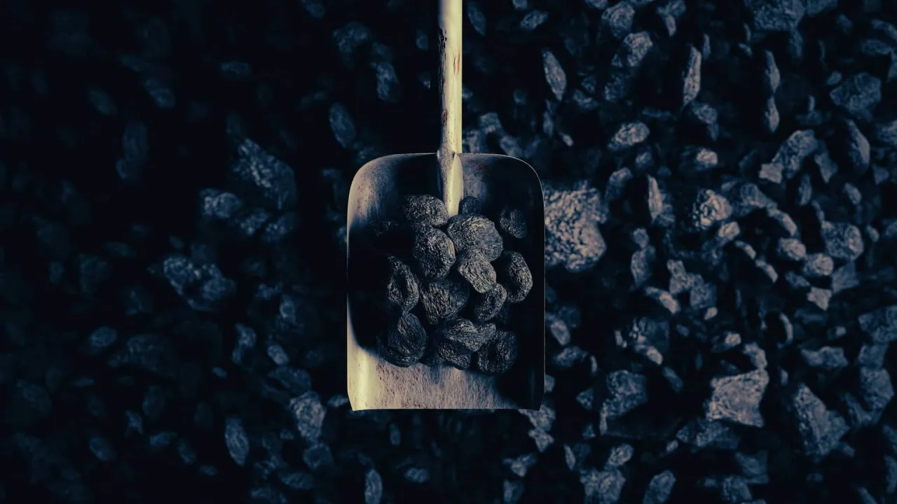 Łopata z węglem, symbol dofinansowania do węgla dla kogoś, kto potrzebuje ogrzać dom.