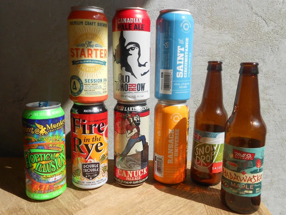 Przykładowe butelki alkoholu i piwa z miarką limit&oacute;w celnych Kanada