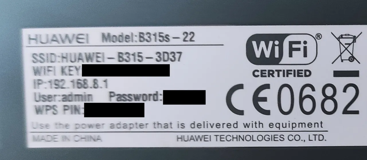 naklejka z hasłem na routerze wifi