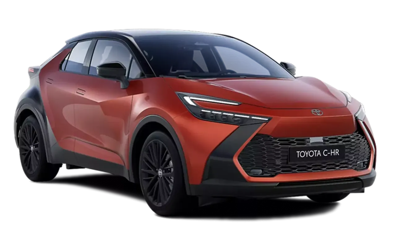 Pomarańczowy Toyota C-HR, hybryda czy benzyna? Nowoczesny design, czarne felgi i kontrastowy dach.