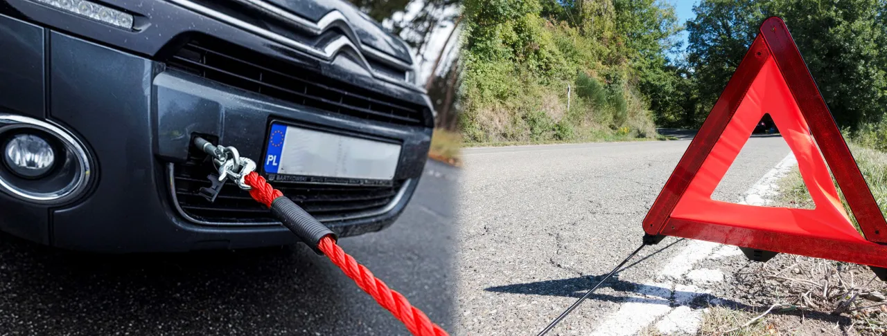 samoch&oacute;d holowany na lince holowniczej z znakiem ostrzegawczym