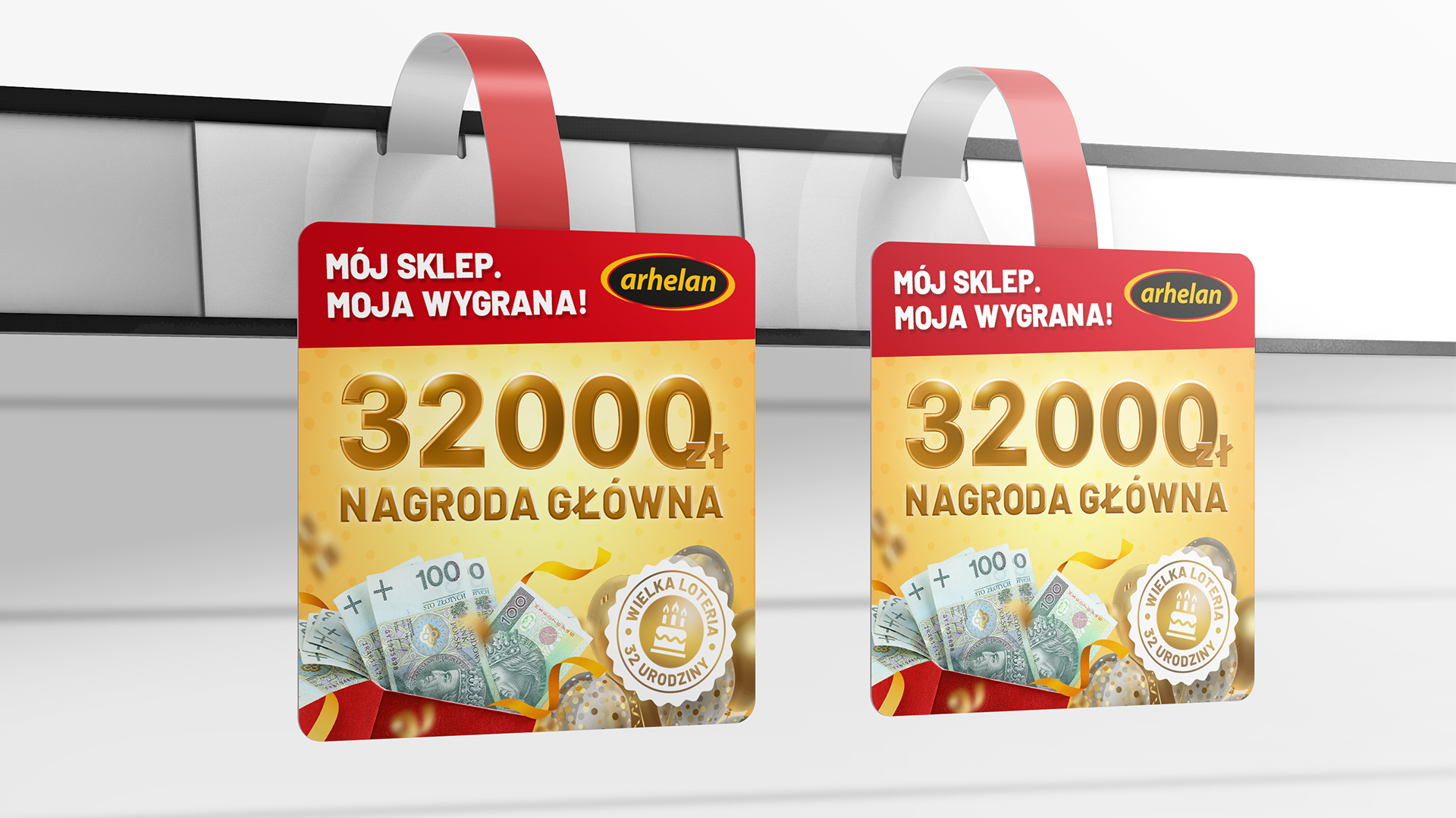 Dwa wobblery reklamowe informujące o nagrodzie głównej 32000 zł w wielkiej loterii promocyjnej.