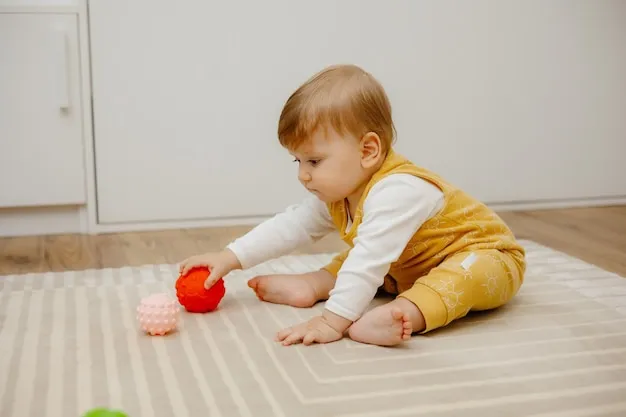 dziecko bawi się piłkami sensorycznymi