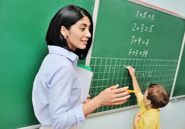 Uczeń rozwiązujący zadania matematyczne na tablicy