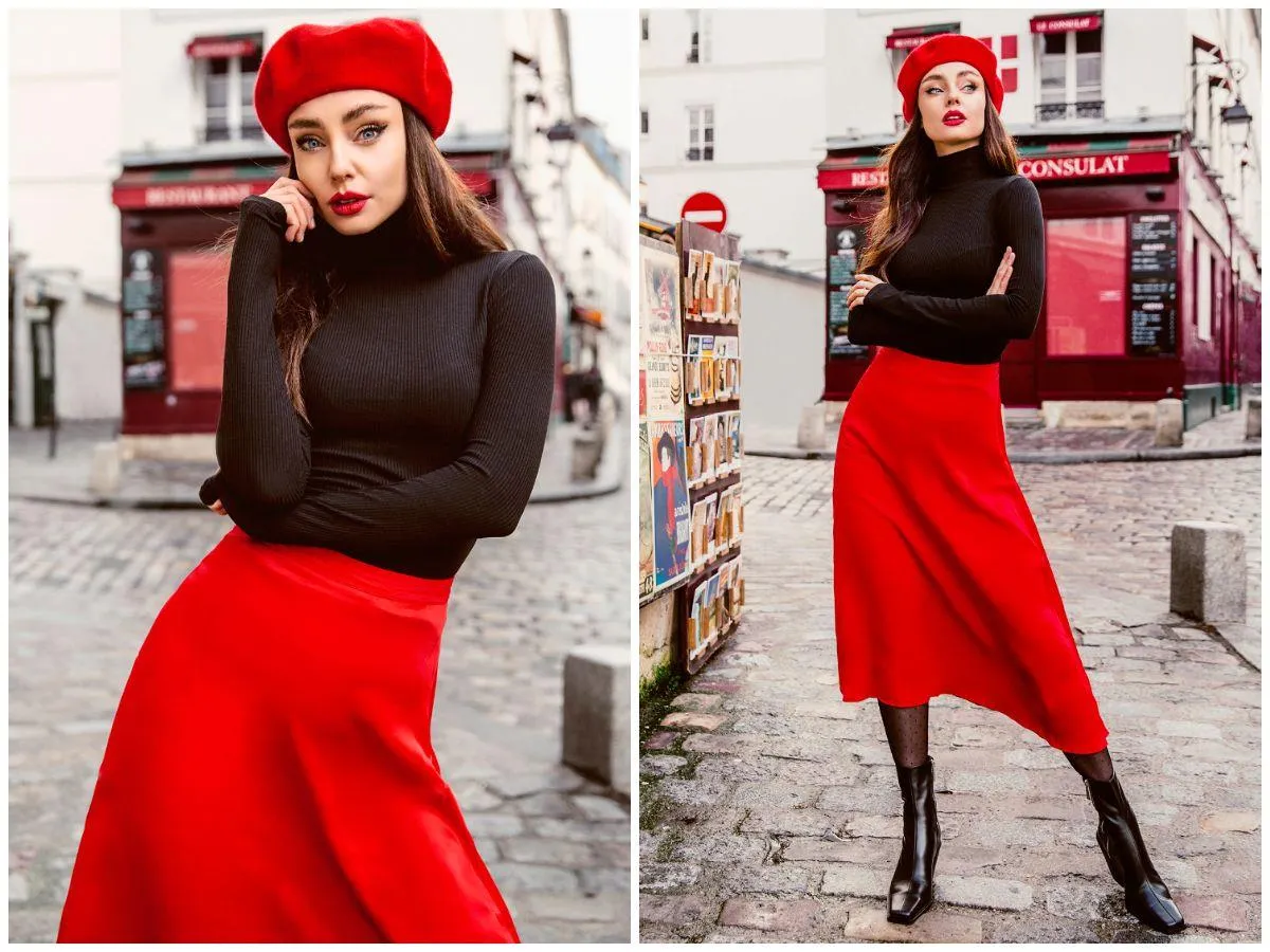 Kobieta w czerwonym beretcie i czarnym golfie, prezentująca power dressing w czerwonej sp&oacute;dnicy, na paryskiej ulicy.