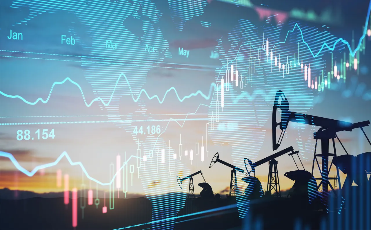 Siluety szyb&oacute;w naftowych na tle wykres&oacute;w giełdowych i mapy świata. Ilustruje to co to jest rolowanie na giełdzie i handel surowcami.