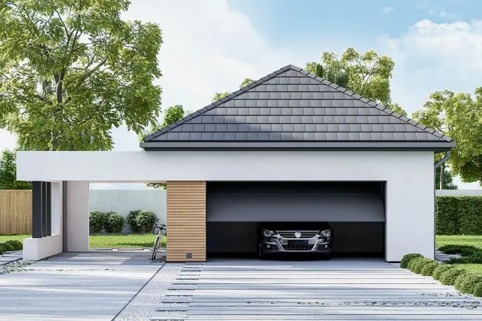 nowoczesny garaż jednostanowiskowy murowany obok domu jednorodzinnego