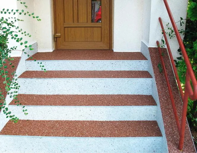 przykłady wykończeń podjazdu: kamienny dywan, płytki gresowe, żywica