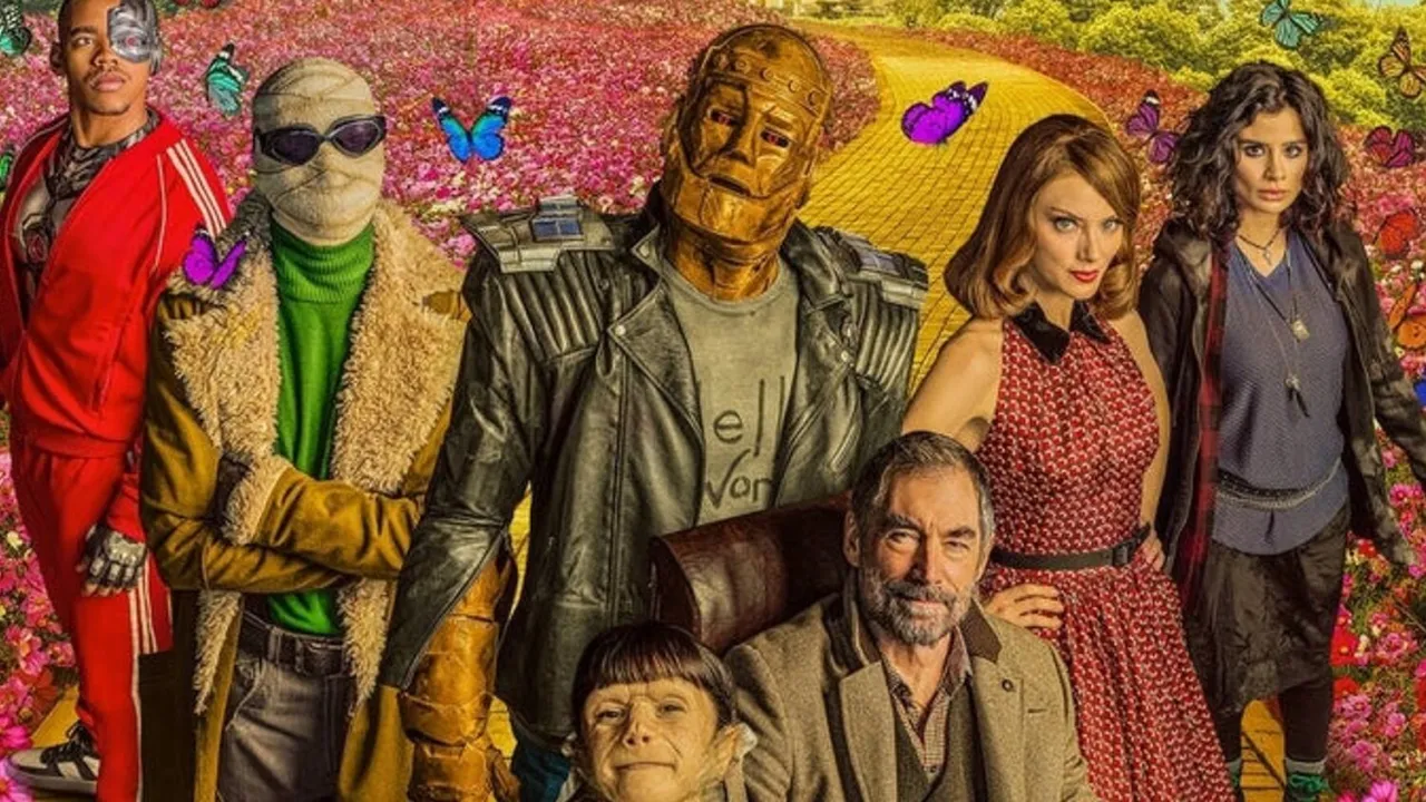 Doom Patrol obsada: Cyborg, Negative Man, Robotman, Rita Farr, Larry Trainor, Cliff Steele i Jane w otoczeniu kolorowych kwiatów i motyli.