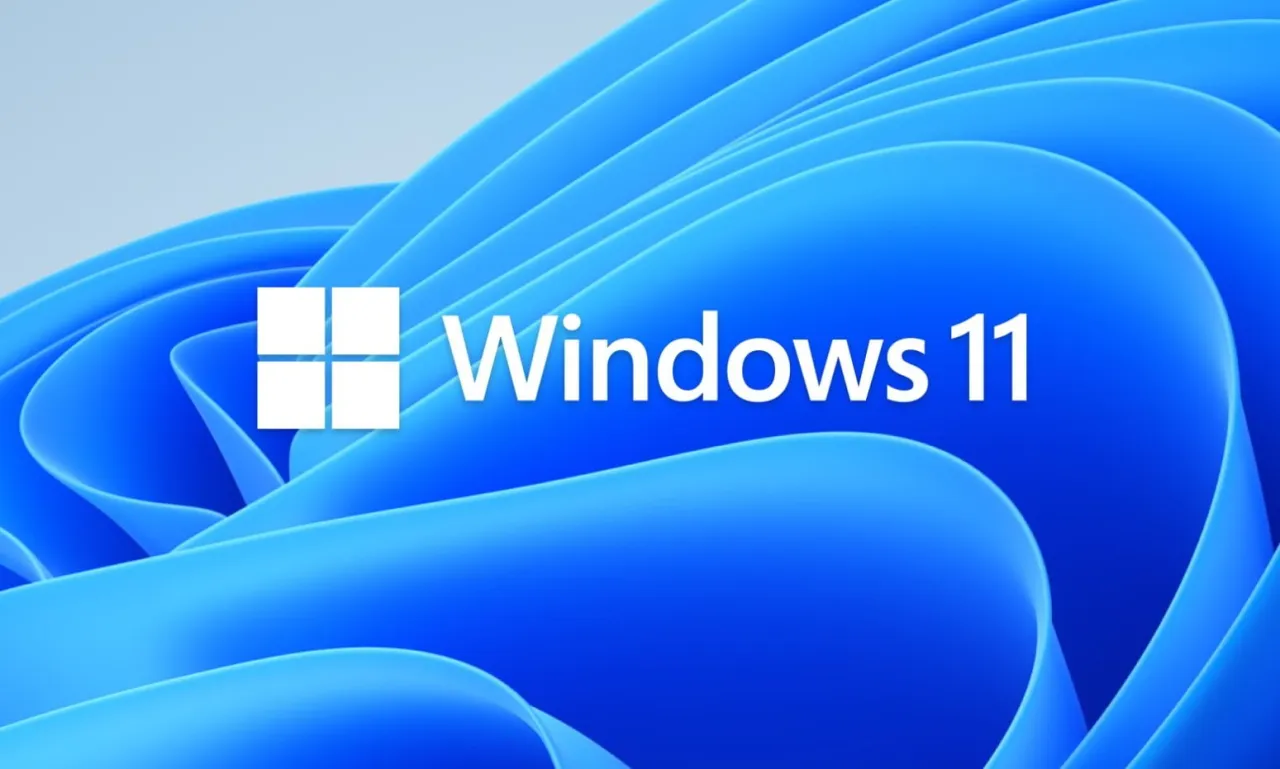 Logo Windows 11 na tle falujących, niebieskich kształt&oacute;w.