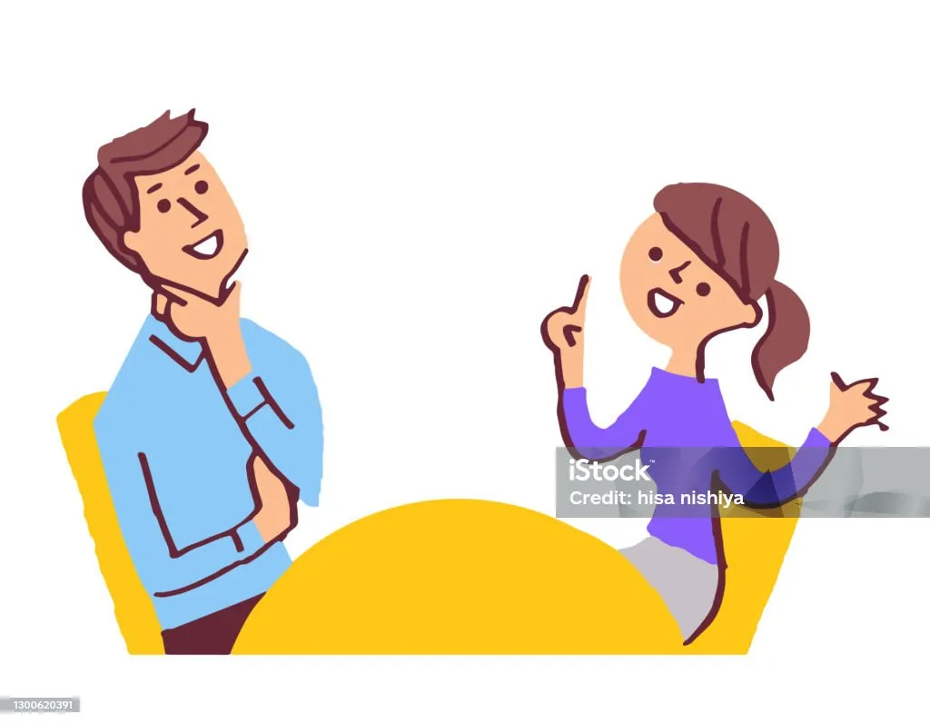 dwie osoby rozmawiające w empatyczny sposób przy stole