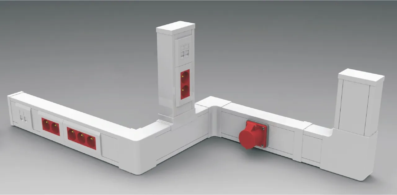 System do układania przewod&oacute;w elektrycznych w korytkach, z gniazdami i wtyczkami.