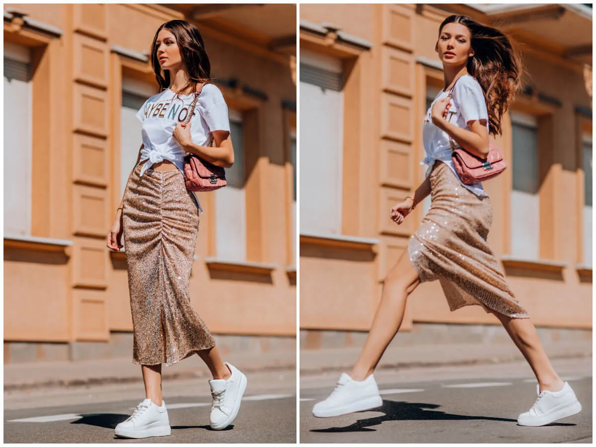 kobieta w eleganckim płaszczu z klasyczną sk&oacute;rzaną listonoszką