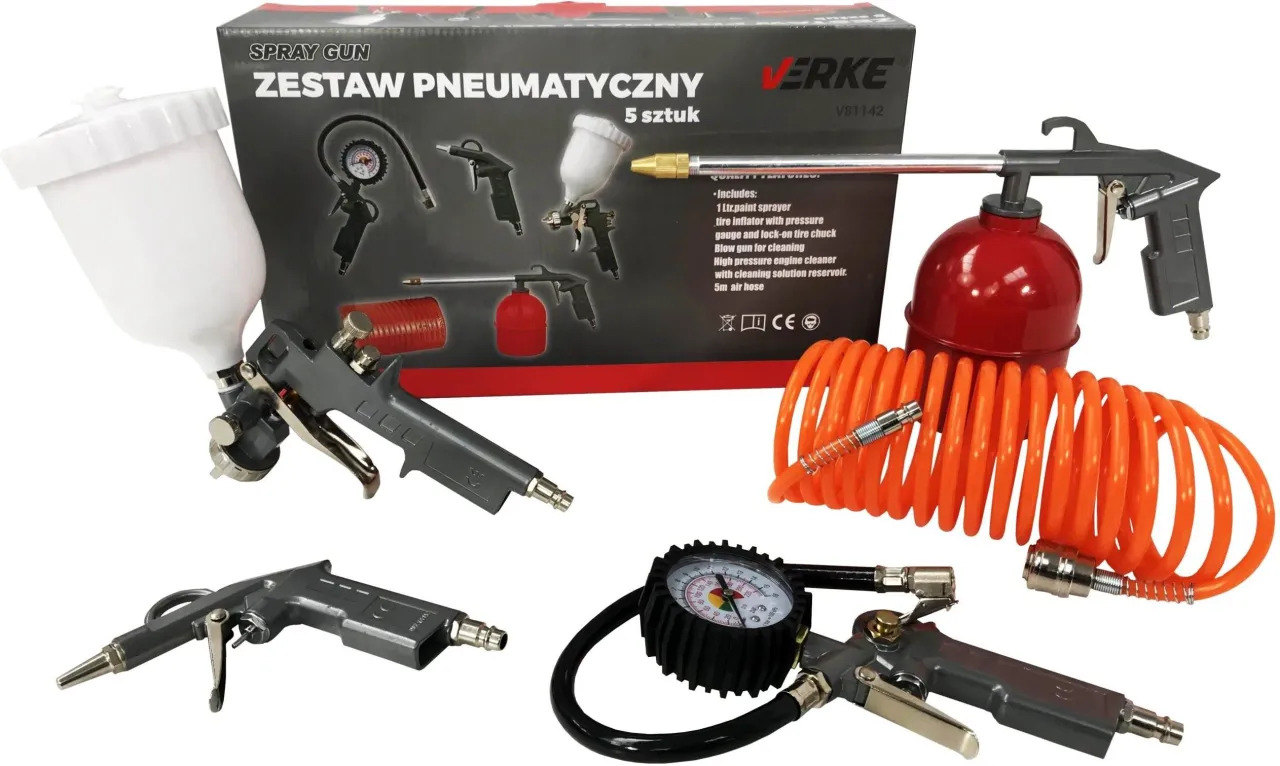 Pistolet lakierniczy i kompresor w garażu