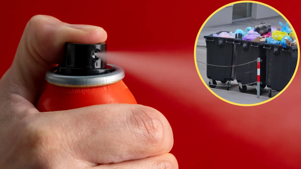 Puszka po dezodorancie i puszka po farbie w sprayu leżące obok siebie na tle kolorowych koszy do segregacji