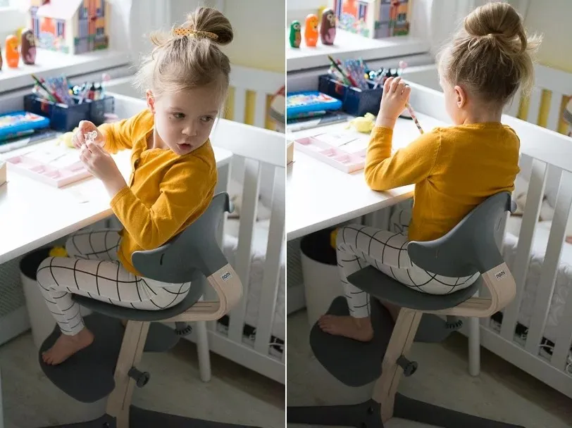 Dziecko siedzące prawidłowo przy biurku z ergonomicznym krzesłem