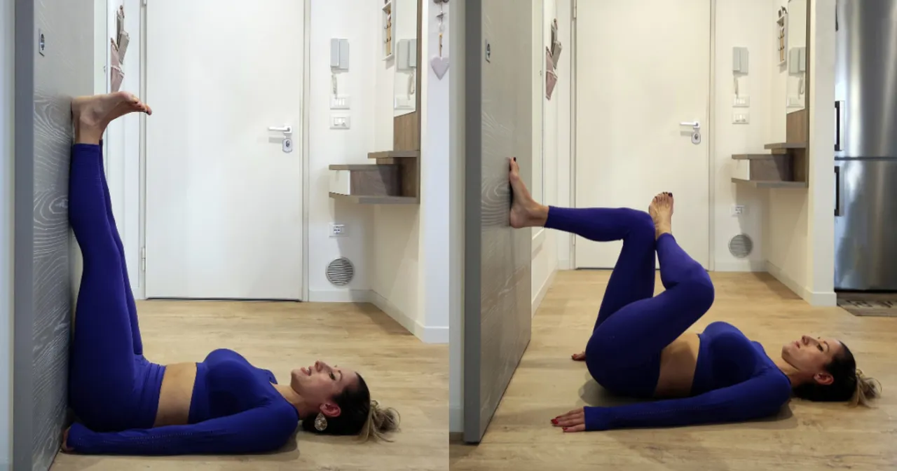 Kobieta ćwiczy pilates przy ścianie, wykonując ćwiczenia na nogi i brzuch. To świetny spos&oacute;b, by dowiedzieć się, co to jest pilates i jak poprawić kondycję.