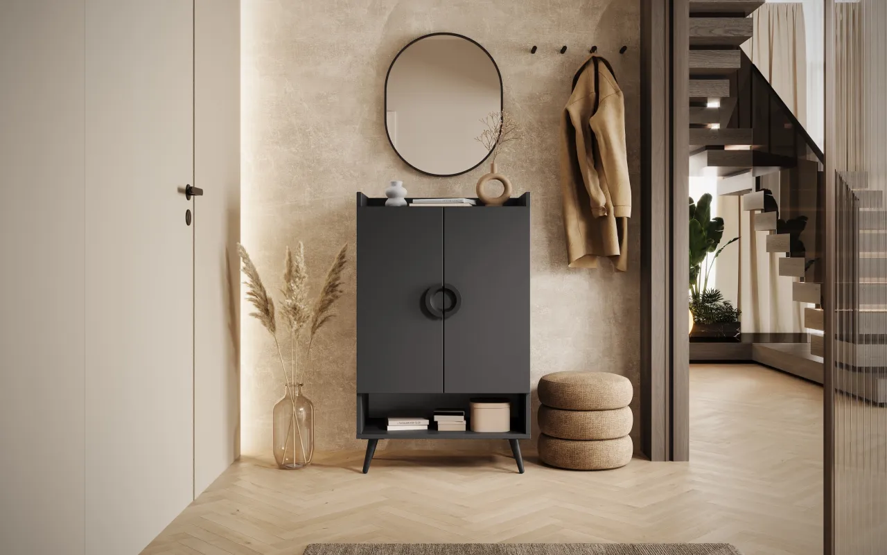 okrągłe lustro w przedpokoju z szafką na buty