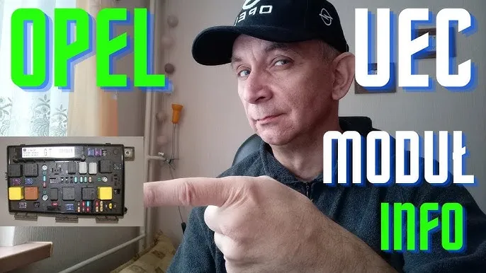 Opel Zafira B skrzynka bezpieczników pod maską UEC lokalizacja