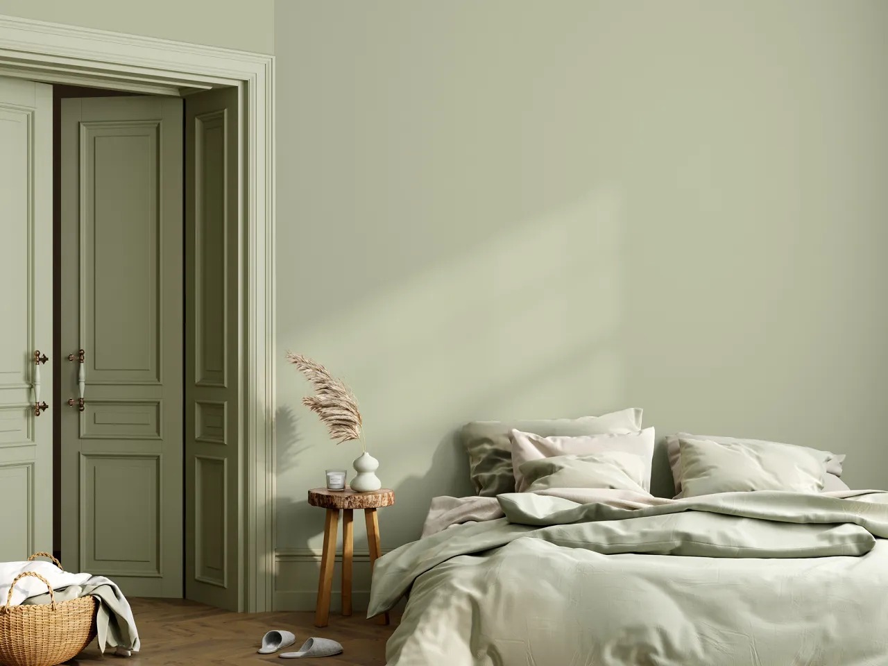 Sypialnia w odcieniach zieleni. Wygodne łóżko, wiklinowy kosz i stylowe drzwi tworzą oazę spokoju.